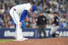 Blue Jays pitcher Jeff Hoffman (left) reacts after giving up a three-run home run to Minnesota Twins outfielder Matt Wallner (back right) during the ninth inning of a Major League Baseball game in Toronto on Tuesday, Aug. 26, 2025. THE CANADIAN PRESS/Frank Gunn