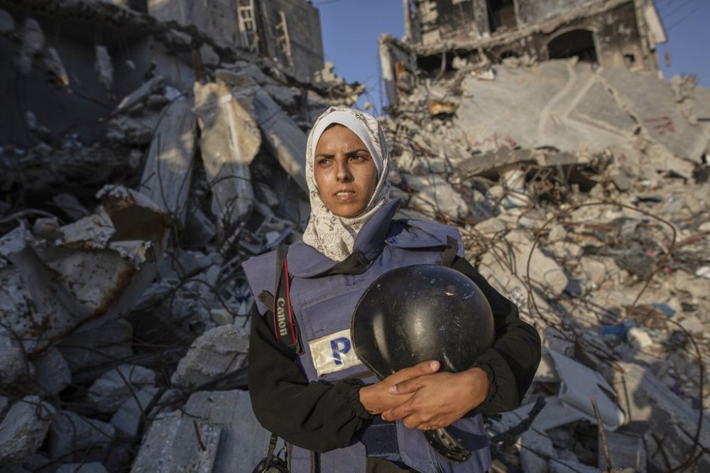 Freelance journalist Mariam Dagga, 33, who had been working with the Associated Press and other outlets since the start of the Gaza war, poses for a portrait in Khan Younis, southern Gaza Strip, June 14, 2024. She was among eight people, including four journalists, killed Monday in an Israeli strikes on Nasser Hospital in Khan Younis. (AP Photo/Jehad Alshrafi)
