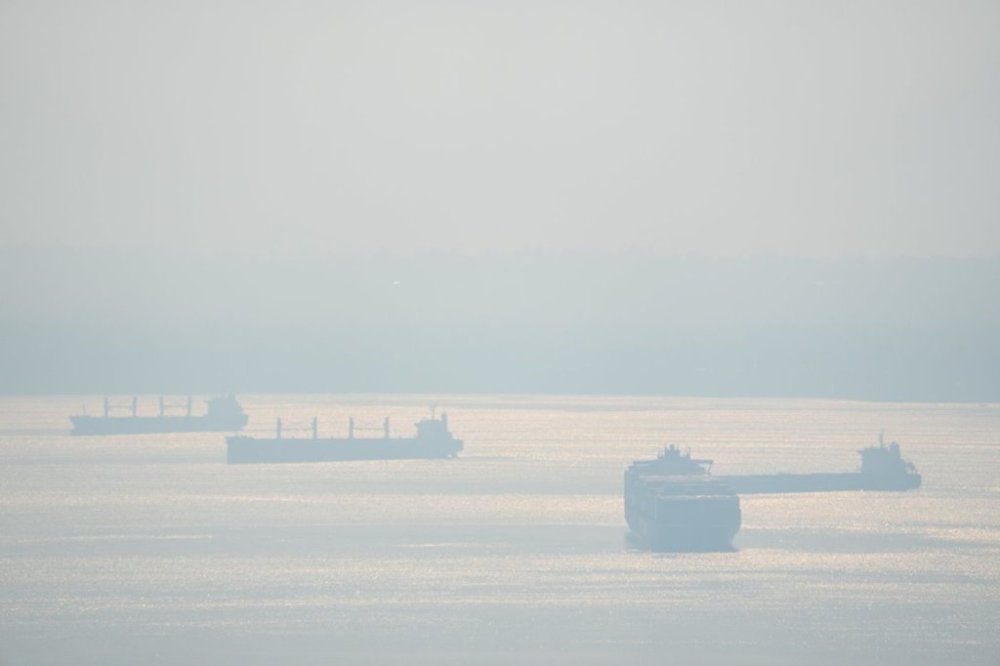 Poor air quality is seen as a smoky haze against downtown Vancouver, Tuesday, Oct. 18, 2022. THE CANADIAN PRESS/Jonathan Hayward