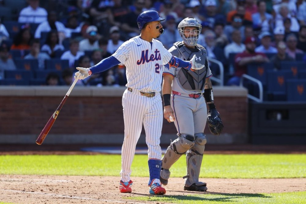 New York Mets' Mark Vientos reacts after being hit by a pitch from Miami Marlins' Sandy Alcantara during the seventh inning of a baseball game, Sunday, Aug. 31, 2025, in New York. (AP Photo/Noah K. Murray)