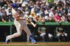 Seattle Mariners' Cal Raleigh hits a two-run home run to break the record for single-season home runs by a catcher at 49 against the Athletics during the second inning of a baseball game, Sunday, Aug. 24, 2025, in Seattle. (AP Photo/Lindsey Wasson)