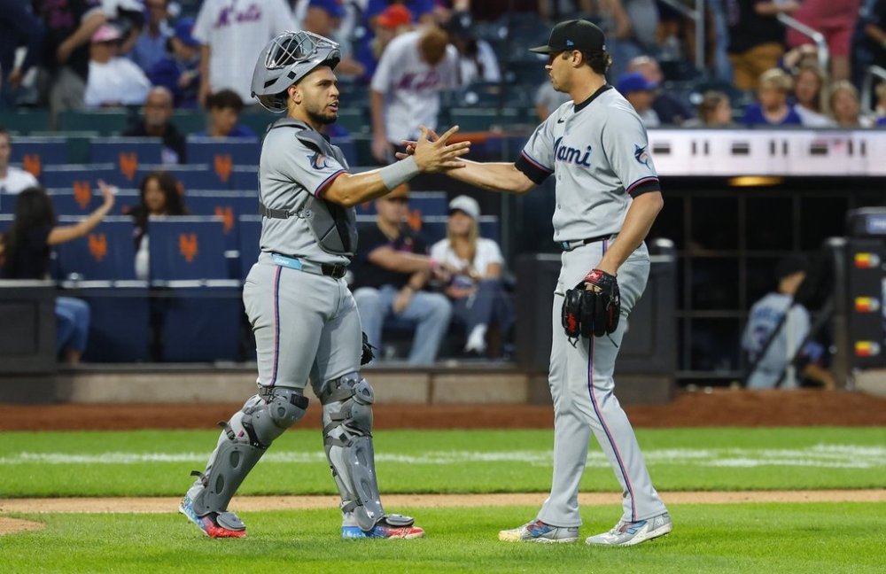 Miami Marlins catcher Agustín Ramírez (50) and pitcher Tyler Phillips celebrate after defeating the New York Mets, Saturday, Aug. 30, 2025, in New York. (AP Photo/Noah K. Murray)