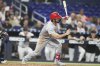 St. Louis Cardinals' Thomas Saggese follows through on a single during the third inning of a baseball game against the Miami Marlins, Tuesday, Aug. 19, 2025, in Miami. (AP Photo/Lynne Sladky)