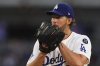 Los Angeles Dodgers starting pitcher Clayton Kershaw gets set to pitch during the second inning of a baseball game against the Toronto Blue Jays, Friday, Aug. 8, 2025, in Los Angeles. (AP Photo/Mark J. Terrill)