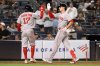 Boston Red Sox's David Hamilton, left, and Roman Anthony, right, react after Anthony hit a two-run home run during the ninth inning of a baseball game against the New York Yankees, Thursday, Aug. 21, 2025, in New York. (AP Photo/Pamela Smith)