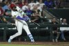 Arizona Diamondbacks' Ketel Marte connects for a three-run home run against the Texas Rangers during the seventh inning of a baseball game Tuesday, Sept. 2, 2025, in Phoenix. (AP Photo/Ross D. Franklin)