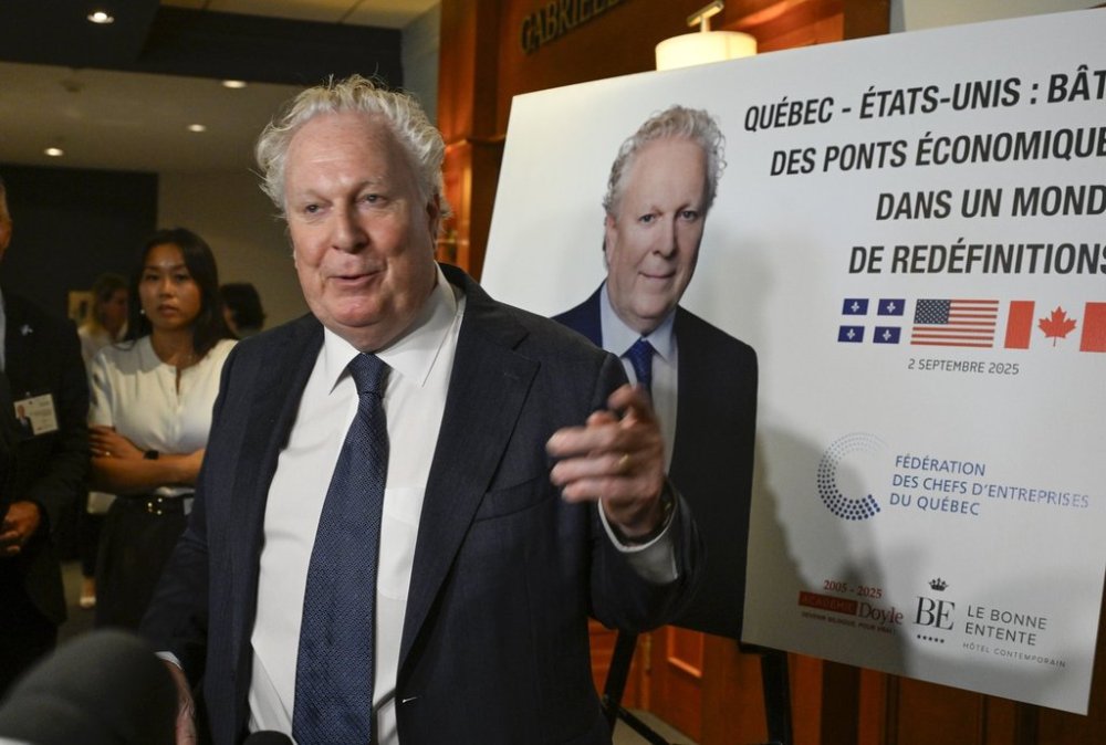 Former Quebec premier Jean Charest speaks to reporters at a business luncheon on relations with the United States, in Quebec City, Tuesday, Sept. 2, 2025. THE CANADIAN PRESS/Jacques Boissinot