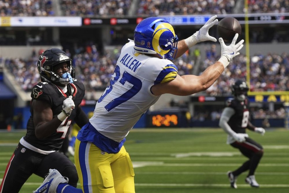 Los Angeles Rams tight end Davis Allen (87) catches a touchdown pass against Houston Texans cornerback Kamari Lassiter (4) during the second half of an NFL football game, Sunday, Sept. 7, 2025, in Inglewood, Calif. (AP Photo/Gregory Bull)