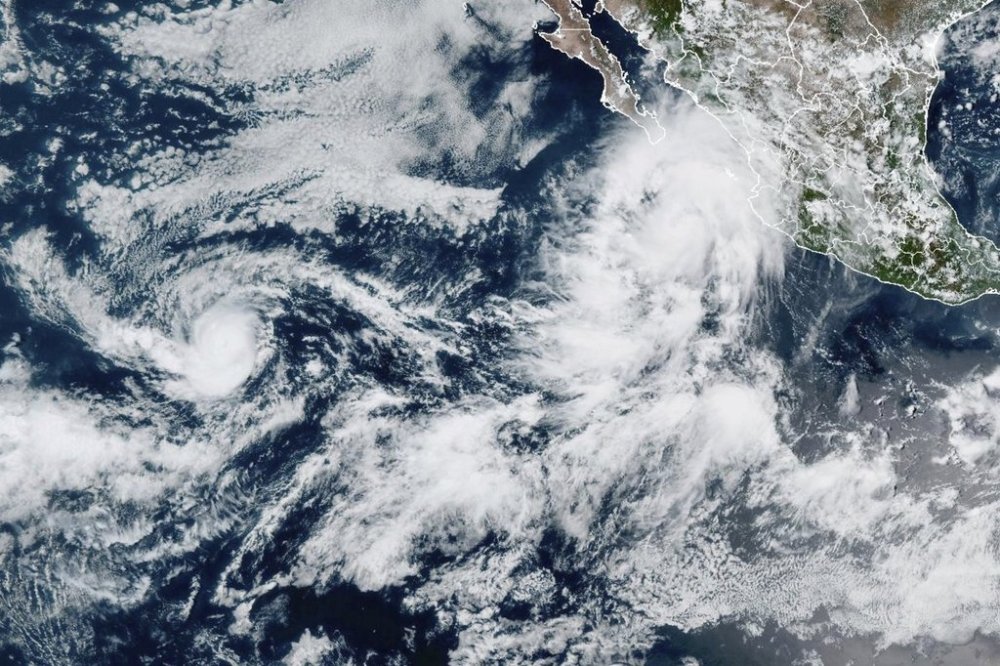 This GOES-19 GeoColor satellite image taken Tuesday, Sept. 2, 2025 at 6 p.m. EDT and provided by NOAA, shows Tropical Storm Lorena, upper right, off Mexico's western coast, and Hurricane Kiko, left, in open waters of the eastern Pacific Ocean. (NOAA via AP)