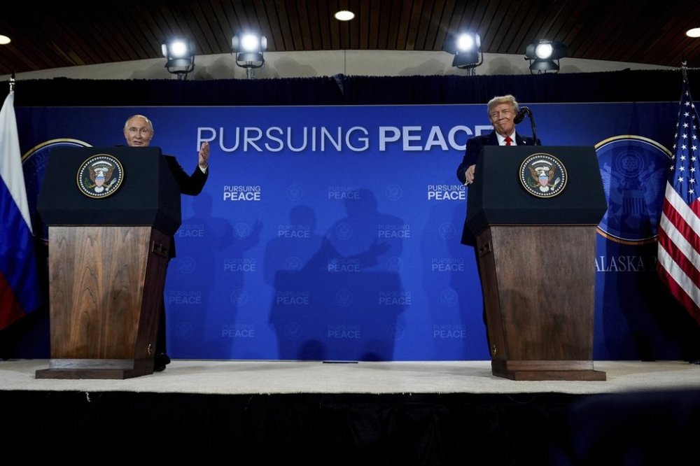 President Donald Trump listens as Russia's President Vladimir Putin speaks during a news conference at Joint Base Elmendorf- Richardson, Friday, Aug. 15, 2025, in Anchorage, Alaska. (AP Photo/Julia Demaree Nikhinson)