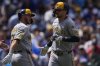 Milwaukee Brewers' Brice Turang (2), right, celebrates after hitting a two-run home run during the second inning of a baseball game against the Chicago Cubs, Thursday, Aug. 21, 2025, in Chicago. (AP Photo/Erin Hooley)