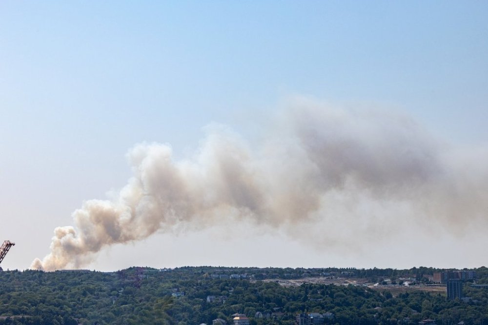 A large billow of smoke from a wildfire near the Susies Lake Area of Halifax is seen, Tuesday, Aug. 12, 2025. THE CANADIAN PRESS/Kelly Clark