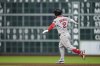 Boston Red Sox's Alex Bregman celebrates after hitting a two-run home run against the Houston Astros during the sixth inning of a baseball game Tuesday, Aug. 12, 2025, in Houston. (AP Photo/David J. Phillip)
