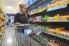 Dora Diaz, left, and her daughter Fernanda Diaz, 14, shops for school supplies at a Walmart in Dallas, Texas, Tuesday, Aug. 12, 2025. (AP Photo/LM Otero)