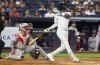 New York Yankees' Jazz Chisholm Jr. follows through on a two run home run during the second inning of a baseball game against the Boston Red Sox, Sunday, Aug. 24, 2025, in New York. (AP Photo/Noah K. Murray)