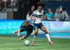 Sporting Kansas City's Jansen Miller (15) trips as he fights for the ball with Vancouver Whitecaps' Jayden Nelson, right, during the second half of an MLS soccer match in Vancouver, on Saturday, July 26, 2025. THE CANADIAN PRESS/Ethan Cairns