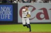 New York Yankees shortstop Anthony Volpe fails to throw out Minnesota Twins' Byron Buxton at first base during the sixth inning of a baseball game against the Minnesota Twins, Wednesday, Aug. 13, 2025, in New York. (AP Photo/Yuki Iwamura)