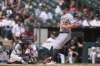 Detroit Tigers' Kerry Carpenter (30) jogs by Chicago White Sox catcher Edgar Quero (7) to score on a sacrifice fly by Wenceel Pérez during the sixth inning of a baseball game Wednesday, Aug. 13, 2025, in Chicago. (AP Photo/Erin Hooley)