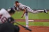 Baltimore Orioles pitcher Trevor Rogers delivers during the first inning of a baseball game against the Boston Red Sox at Fenway Park, Monday, Aug. 18, 2025, in Boston. (AP Photo/Charles Krupa)
