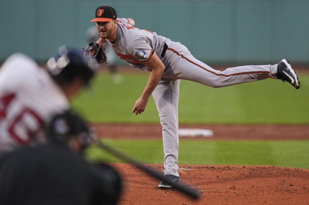 Baltimore Orioles pitcher Trevor Rogers delivers during the first inning of a baseball game against the Boston Red Sox at Fenway Park, Monday, Aug. 18, 2025, in Boston. (AP Photo/Charles Krupa)
