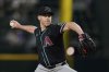Arizona Diamondbacks starting pitcher Anthony DeSclafani throws to the Texas Rangers in the first inning of a baseball game Tuesday, Aug. 12, 2025, in Arlington, Texas. (AP Photo/Tony Gutierrez)