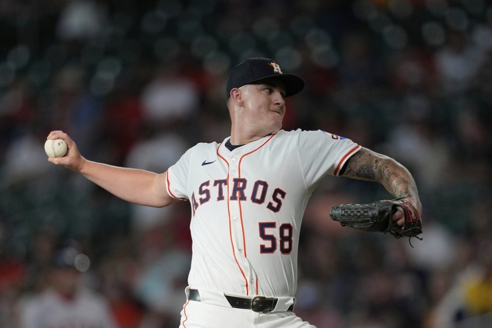 Houston Astros starting pitcher Hunter Brown throws against the Boston Red Sox during the first inning of a baseball game Wednesday, Aug. 13, 2025, in Houston. (AP Photo/David J. Phillip)