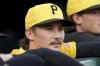 Pittsburgh Pirates pitcher Bubba Chandler stands in the dugout before a baseball game against the Colorado Rockies, Friday, Aug. 22, 2025, in Pittsburgh. (AP Photo/Matt Freed)