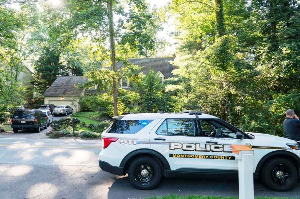 Former National Security Advisor John Bolton's house is seen with a Montgomery County, Md., police vehicle outside, as FBI agents search the home, Friday, Aug. 22, 2025 in Bethesda, Md. (AP Photo/Jose Luis Magana)