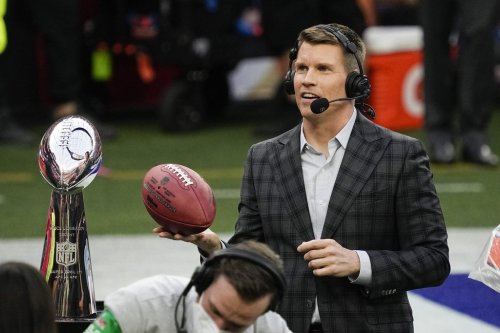 FILE - Scott Hanson, host of NFL RedZone, is seen near the Lombardi Trophy prior to the start of the NFL Super Bowl 56 football game Feb. 13, 2022, in Inglewood, Calif. (AP Photo/Julio Cortez, File)