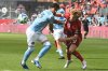 Toronto FC striker Charlie Sharp, right, fights for position against New York City FC’s centre back Thiago Martins during second half MLS soccer action in Toronto on Saturday, April 26, 2025. THE CANADIAN PRESS/Jon Blacker