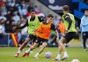 Manchester City's Phil Foden, center, and Rodri during a training session at the City Football Academy, Manchester, England, Tuesday, Aug. 5, 2025. (Peter Byrne/PA via AP)