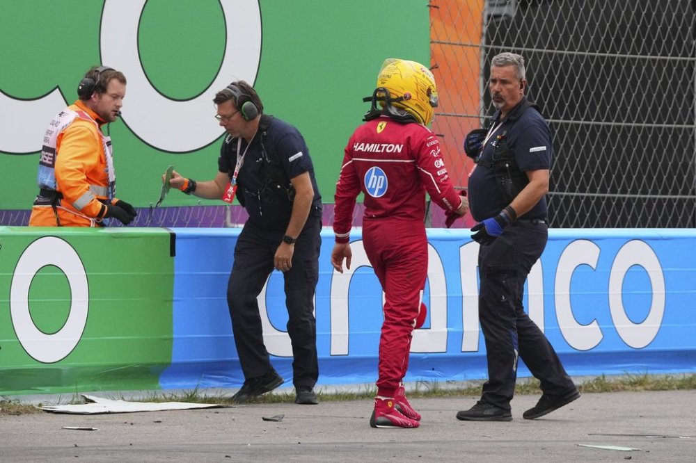 Ferrari driver Lewis Hamilton of Britain walks away after a crash during the Formula One Dutch Grand Prix in Zandvoort, Netherlands, Sunday, Aug. 31, 2025. (AP Photo/Peter Dejong)