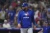 Toronto Blue Jays manager John Schneider (14) in the sixth inning of a baseball game Tuesday, Aug. 5, 2025, in Denver. (AP Photo/David Zalubowski)