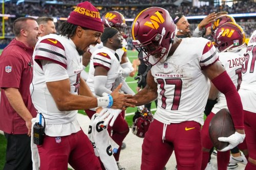 FILE - Washington Commanders wide receiver Terry McLaurin (17) celebrates with quarterback Jayden Daniels after scoring a touchdown during the second half of an NFL football game against the Dallas Cowboys, Jan. 5, 2025, in Arlington, Texas. (AP Photo/Josh McSwain, File)