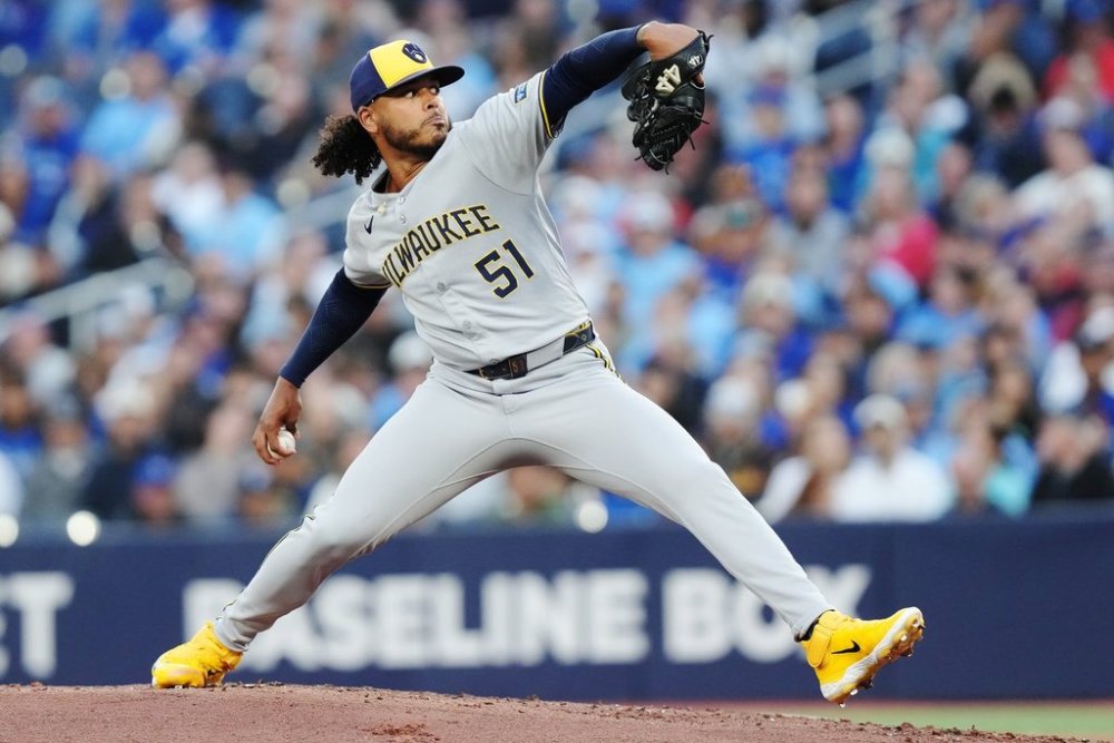 Milwaukee Brewers pitcher Freddy Peralta (51) works against the Toronto Blue Jays during first inning MLB baseball action in Toronto on Friday, Aug. 29, 2025. THE CANADIAN PRESS/Chris Young