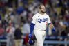 Los Angeles Dodgers' Max Muncy walks off the field after the ninth inning of a baseball game against the St. Louis Cardinals Monday, Aug. 4, 2025, in Los Angeles, Calif. (AP Photo/Eric Thayer)