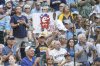 A fan holds up a sign during the fourth inning of a baseball between the Pittsburgh Pirates and Milwaukee Brewers game, Wednesday, Aug.13, 2025, in Milwaukee. (AP Photo/Jeffrey Phelps)