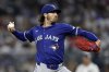 Toronto Blue Jays pitcher Kevin Gausman throws during the fourth inning of a baseball game against the New York Yankees, Friday, Sept. 5, 2025, in New York. (AP Photo/Adam Hunger)