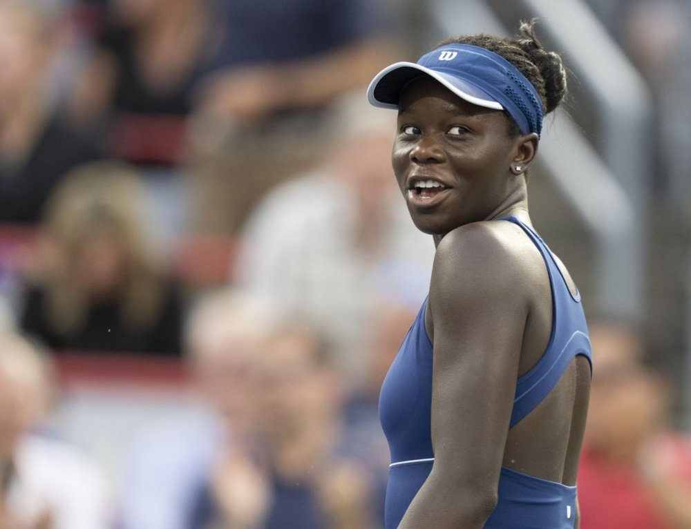 Victoria Mboko of Canada reacts during her match against Naomi Osaka of Japan during the National Bank Open final in Montreal on Thursday, Aug. 7, 2025. THE CANADIAN PRESS/Christinne Muschi