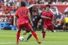 United States' Christian Pulisic, center, shoots in between players during a friendly soccer match against South Korea on Saturday, Sept. 6, 2025, in Harrison, N.J. (AP Photo/Andres Kudacki)