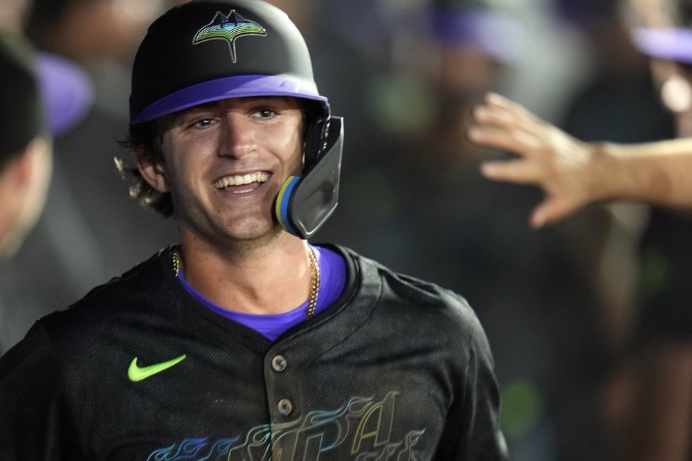 Tampa Bay Rays' Carson Williams celebrates in the dugout after his two-run home run off St. Louis Cardinals pitcher Ryan Fernandez during the seventh inning of a baseball game Friday, Aug. 22, 2025, in Tampa, Fla. (AP Photo/Chris O'Meara)
