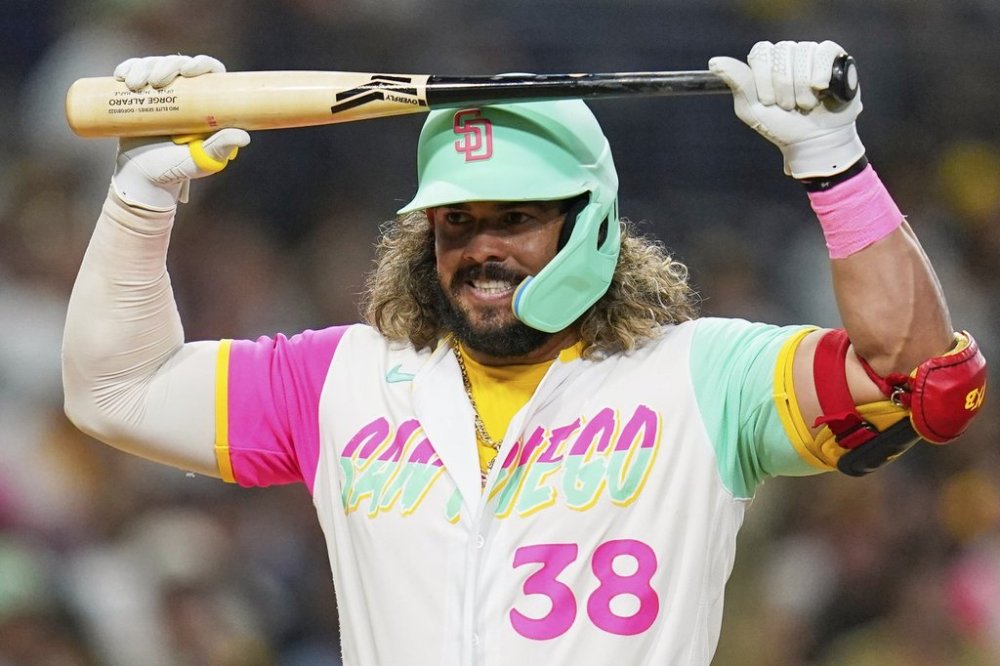 FILE - San Diego Padres' Jorge Alfaro reacts after striking out during the sixth inning of a baseball game against the Washington Nationals, Aug. 19, 2022, in San Diego. (AP Photo/Gregory Bull, File)
