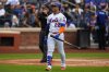 New York Mets' Juan Soto (22) reacts after striking out during the third inning of a baseball game against the Cleveland Guardians, Wednesday, Aug. 6, 2025, in New York. (AP Photo/Yuki Iwamura)