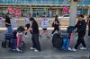 Travellers pass Air Canada flight attendants on strike at Pearson International Airport in Toronto, on Monday, Aug. 18, 2025. THE CANADIAN PRESS/Sammy Kogan