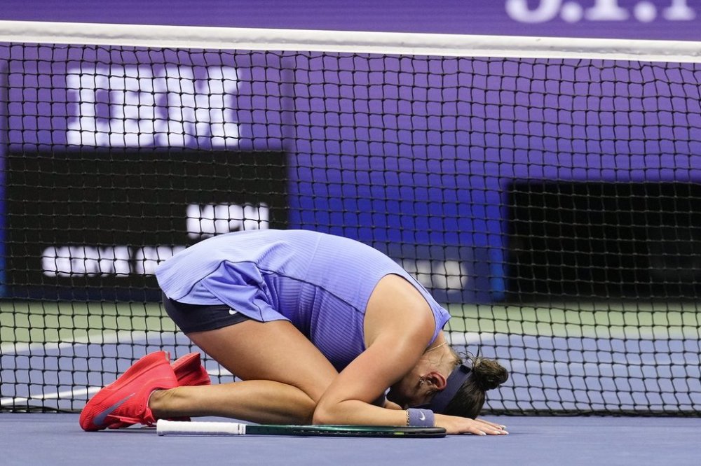 Amanda Anisimova, of the United States,reacts after defeating Naomi Osaka, of Japan, during the women's singles semifinals of the U.S. Open tennis championships, Friday, Sept. 5, 2025, in New York. (AP Photo/Seth Wenig)