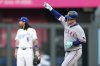 Texas Rangers' Joc Pederson celebrates as he runs the bases after hitting a solo home run during the fourth inning of a baseball game against the Kansas City Royals, Tuesday, Aug. 19, 2025, in Kansas City, Mo. (AP Photo/Charlie Riedel)