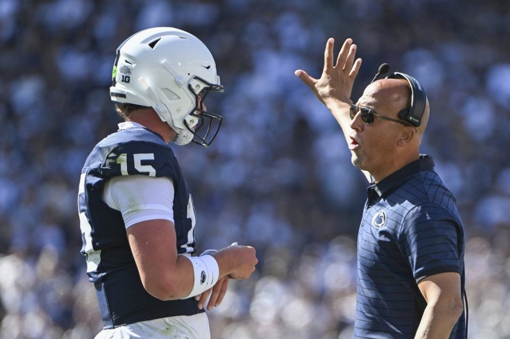 Penn State head coach James Franklin talks with quarterback Drew Allar (15) during the first quarter of an NCAA college football game against Nevada, Saturday, Aug. 30, 2025, in State College, Pa. (AP Photo/Barry Reeger)