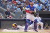 Toronto Blue Jays catcher Alejandro Kirk (30) looks for the ball as Milwaukee Brewers outfielder Christian Yelich (22) scores behind him during seventh inning MLB baseball action in Toronto on Saturday, August 30, 2025. THE CANADIAN PRESS/Frank Gunn
