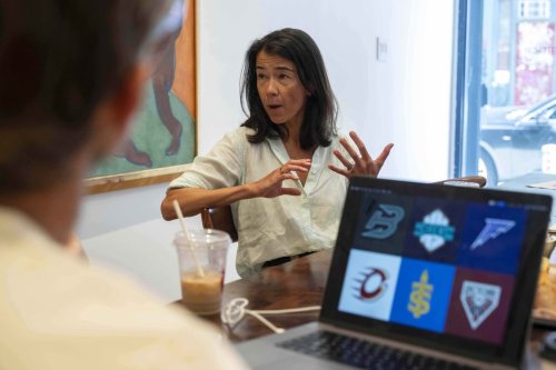 Flower Shop's co-founder and Chief Executive Officer Mary Lou Bunn speaks as sketches of team logos for Professional Women's Hockey League are shown on a computer screen, Thursday, July 30, 2025, in New York. (AP Photo/Yuki Iwamura)
