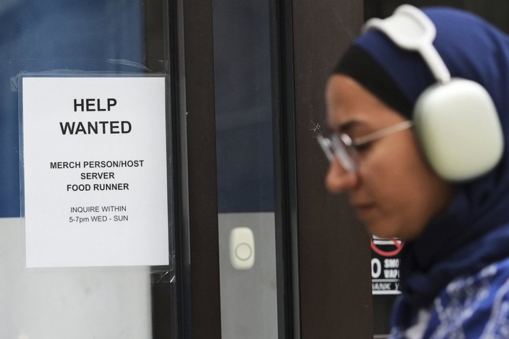 FILE - Help wanted sign is displayed at a live music and blues club in Chicago, Thursday, July 24, 2025. (AP Photo/Nam Y. Huh, File)